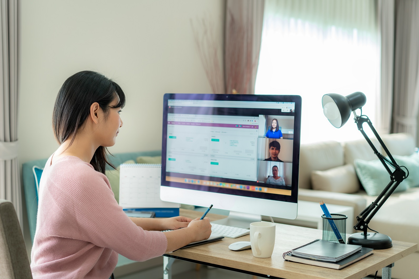 Back View Of Asian Business Woman Talking To Her Colleagues Abou